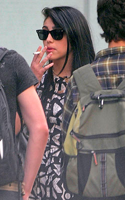Lourdes-Smoking-250x400